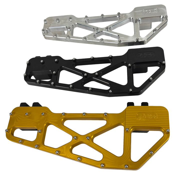 TC Bros. Pro Series MX Slim Floorboards for Harley Davidson Bagger Touring Models feature a skeletal design with metal pins, resembling high-performance pedals in silver, black, and gold. Arranged diagonally, they offer a striking visual appeal.