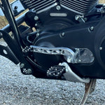 Two billet aluminum TC Bros. Pro Series Truss Shift Levers for 1991-2017 Harley-Davidson Dyna, one black and one silver, with cutout geometric patterns, are displayed on a white background—perfect for your next CNC machined upgrade.