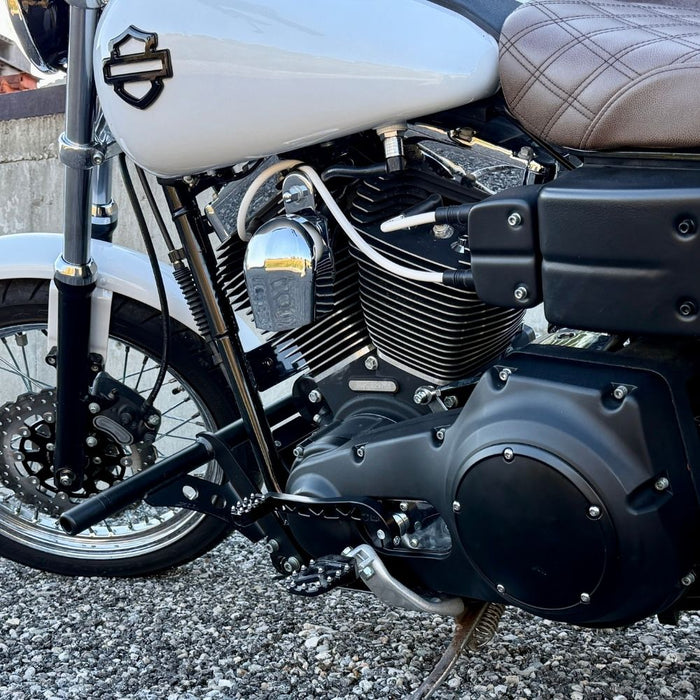 Two billet aluminum TC Bros. Pro Series Truss Shift Levers for 1991-2017 Harley-Davidson Dyna, one black and one silver, with cutout geometric patterns, are displayed on a white background—perfect for your next CNC machined upgrade.