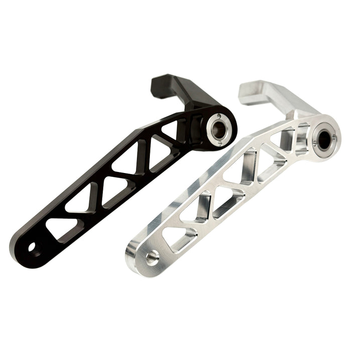 The TC Bros. Pro Series Truss Brake Arm is a 6061-T6 aluminum upgrade for 2018-up Harley-Davidson Softail brake pedals, featuring triangular cutouts and a circular mounting hole—available in silver or black.
