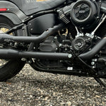 The TC Bros. Pro Series Truss Brake Arm is a 6061-T6 aluminum upgrade for 2018-up Harley-Davidson Softail brake pedals, featuring triangular cutouts and a circular mounting hole—available in silver or black.