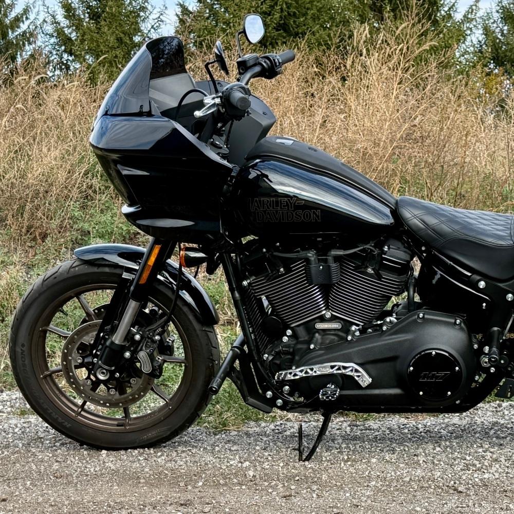 The TC Bros. Pro Series Truss Shift Lever for 2018-Up Harley-Davidson M8 Softail features silver and black metal lever arms with geometric cut-outs and "TC Bros." engraving—ideal for your Softail upgrade.