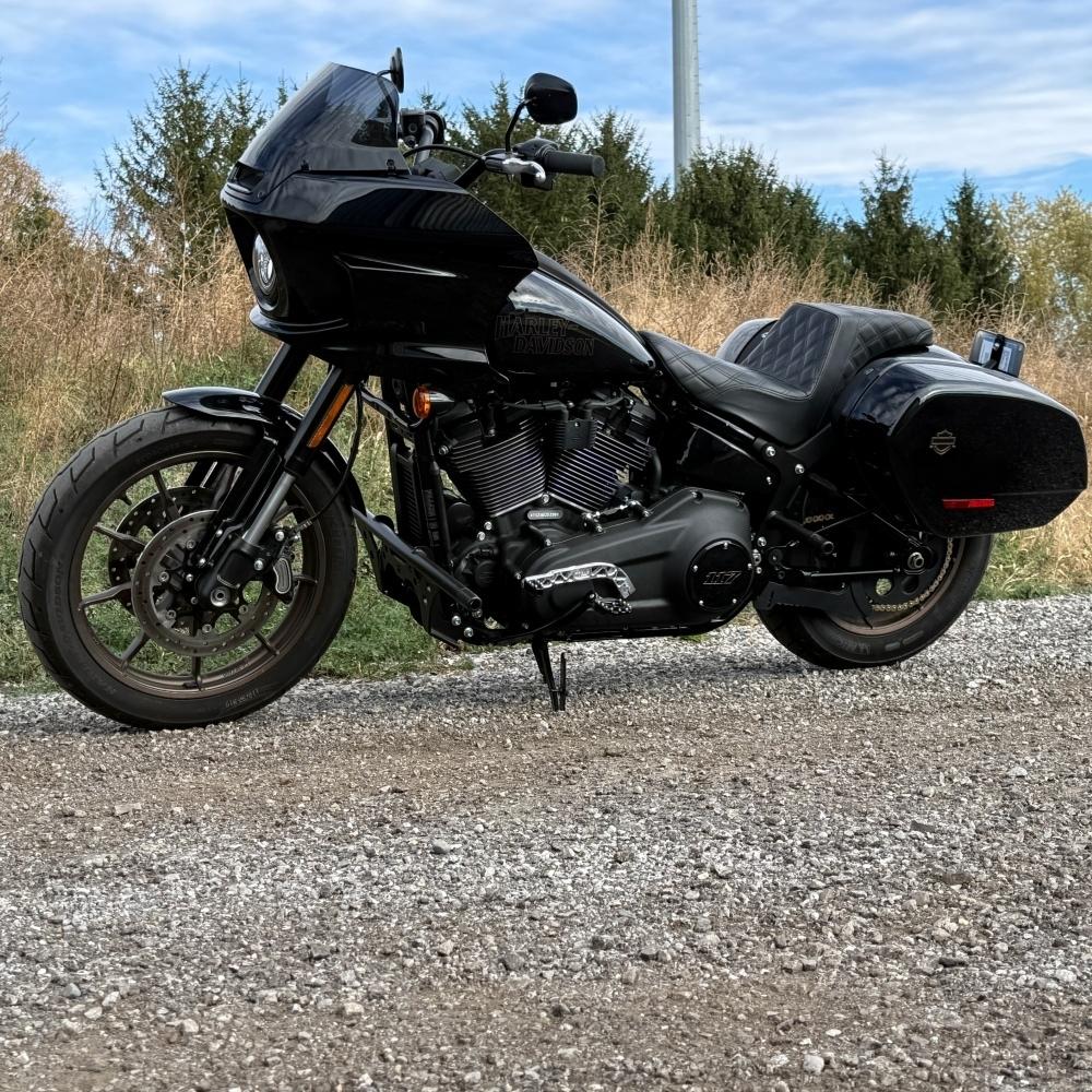 The TC Bros. Pro Series Truss Shift Lever for 2018-Up Harley-Davidson M8 Softail features silver and black metal lever arms with geometric cut-outs and "TC Bros." engraving—ideal for your Softail upgrade.