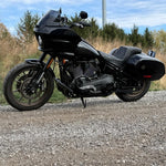 The TC Bros. Pro Series Truss Shift Lever for 2018-Up Harley-Davidson M8 Softail features silver and black metal lever arms with geometric cut-outs and "TC Bros." engraving—ideal for your Softail upgrade.