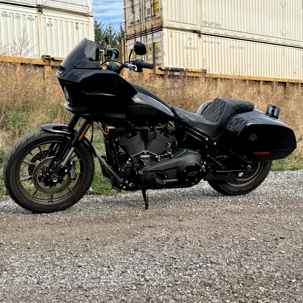 The TC Bros. Pro Series Truss Shift Lever for 2018-Up Harley-Davidson M8 Softail features silver and black metal lever arms with geometric cut-outs and "TC Bros." engraving—ideal for your Softail upgrade.