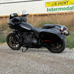 The TC Bros. Pro Series Truss Shift Lever for 2018-Up Harley-Davidson M8 Softail features silver and black metal lever arms with geometric cut-outs and "TC Bros." engraving—ideal for your Softail upgrade.