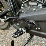 The TC Bros. Pro Series Truss Shift Lever for 2018-Up Harley-Davidson M8 Softail features silver and black metal lever arms with geometric cut-outs and "TC Bros." engraving—ideal for your Softail upgrade.