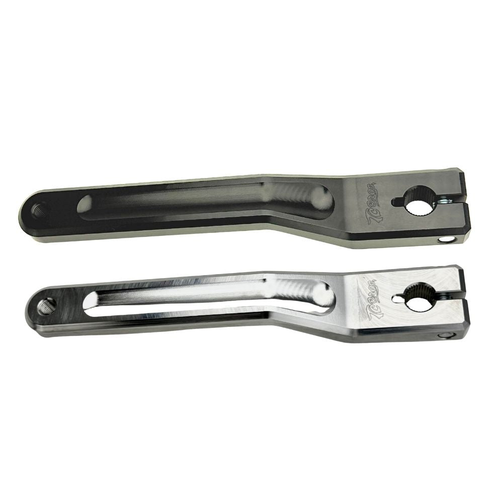 Two silver-finished metal bicycle crank arms, each with a slot and hole for attachment—crafted with the same precision as the TC Bros. Pro Series Shift Lever for 1982-Up Harley-Davidson Big Twin.
