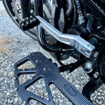 Two silver-finished metal bicycle crank arms, each with a slot and hole for attachment—crafted with the same precision as the TC Bros. Pro Series Shift Lever for 1982-Up Harley-Davidson Big Twin.