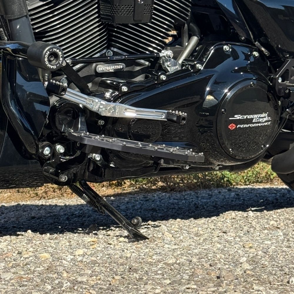 Two silver-finished metal bicycle crank arms, each with a slot and hole for attachment—crafted with the same precision as the TC Bros. Pro Series Shift Lever for 1982-Up Harley-Davidson Big Twin.