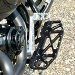 The TC Bros. Pro Series Truss Brake Pedal Arm for 2014-Up Harley-Davidson Touring is shown here in disassembled form, including the black metal pedal arm, matching mounting bracket, and a single screw—all displayed against a white background. Perfect for customizing your Touring/Bagger motorcycle or upgrading your Harley-Davidson with this adjustable brake lever setup from TC Bros.