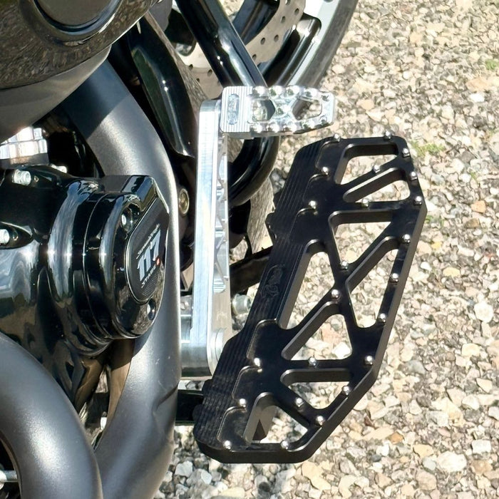 The TC Bros. Pro Series Truss Brake Pedal Arm for 2014-Up Harley-Davidson Touring is shown here in disassembled form, including the black metal pedal arm, matching mounting bracket, and a single screw—all displayed against a white background. Perfect for customizing your Touring/Bagger motorcycle or upgrading your Harley-Davidson with this adjustable brake lever setup from TC Bros.