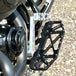 The TC Bros. Pro Series Truss Brake Pedal Arm for 2014-Up Harley-Davidson Touring is shown here in disassembled form, including the black metal pedal arm, matching mounting bracket, and a single screw—all displayed against a white background. Perfect for customizing your Touring/Bagger motorcycle or upgrading your Harley-Davidson with this adjustable brake lever setup from TC Bros.
