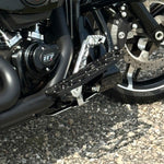 The TC Bros. Pro Series Truss Brake Pedal Arm for 2014-Up Harley-Davidson Touring is shown here in disassembled form, including the black metal pedal arm, matching mounting bracket, and a single screw—all displayed against a white background. Perfect for customizing your Touring/Bagger motorcycle or upgrading your Harley-Davidson with this adjustable brake lever setup from TC Bros.