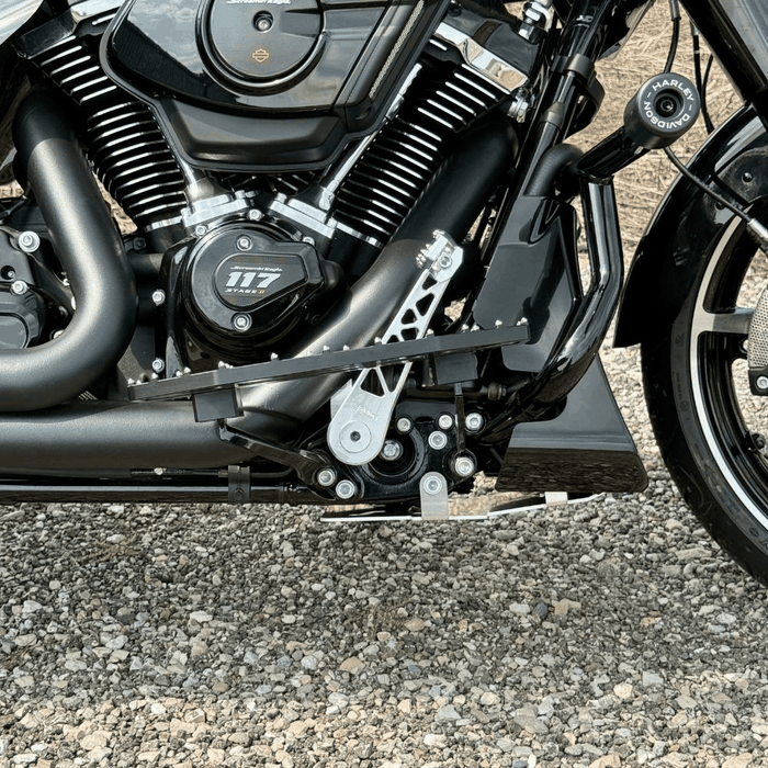 The TC Bros. Pro Series Truss Brake Pedal Arm for 2014-Up Harley-Davidson Touring is shown here in disassembled form, including the black metal pedal arm, matching mounting bracket, and a single screw—all displayed against a white background. Perfect for customizing your Touring/Bagger motorcycle or upgrading your Harley-Davidson with this adjustable brake lever setup from TC Bros.
