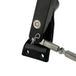 Close-up of a metal hinge mechanism with a black housing, featuring a visible screw and rod connection—ideal for use with the TC Bros. OEM-Style Brake Pedal Conversion Kit for TC Bros. Dyna Mid Controls by TC Bros.