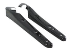 A pair of Wyatt Gatling gloss black elongated metal fender strut covers with curved top cutouts and three bolt holes each, designed for 2004-2022 Harley-Davidson Sportster models, shown side by side on a white background.