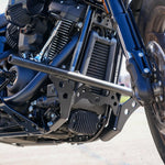 The TC Bros. Front Crash Bar for Harley-Davidson M-8 Softail w/ Mid Controls is a black metal engine guard, shown with mounting hardware—bolts, washers, spacers, and brackets—ideal for added protection on your Softail.