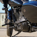 The TC Bros. Front Crash Bar for Harley-Davidson M-8 Softail w/ Mid Controls is a black metal engine guard, shown with mounting hardware—bolts, washers, spacers, and brackets—ideal for added protection on your Softail.