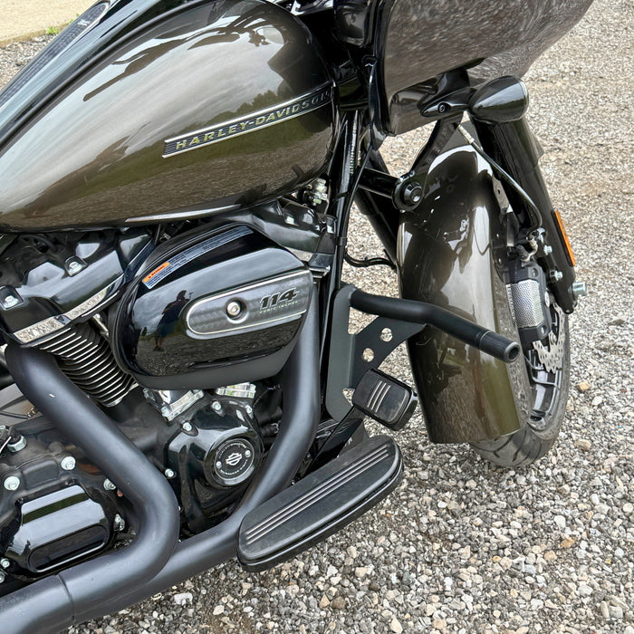 The TC Bros. Front Crash Bar mounting kit for 2014-2023 Harley-Davidson Touring includes bolts and spacers, shown above a motorcycle image—ideal for front engine guard or crash bar installation.