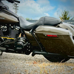 Two black metal TC Bros. Rear Saddlebag Guards with mounting holes, four bolts, two nuts, and four rubber grommets are arranged on a white background—essential components from TC Bros. for installing rear saddlebag guards on 2009-up Harley-Davidson Touring models to enhance rear crash protection.