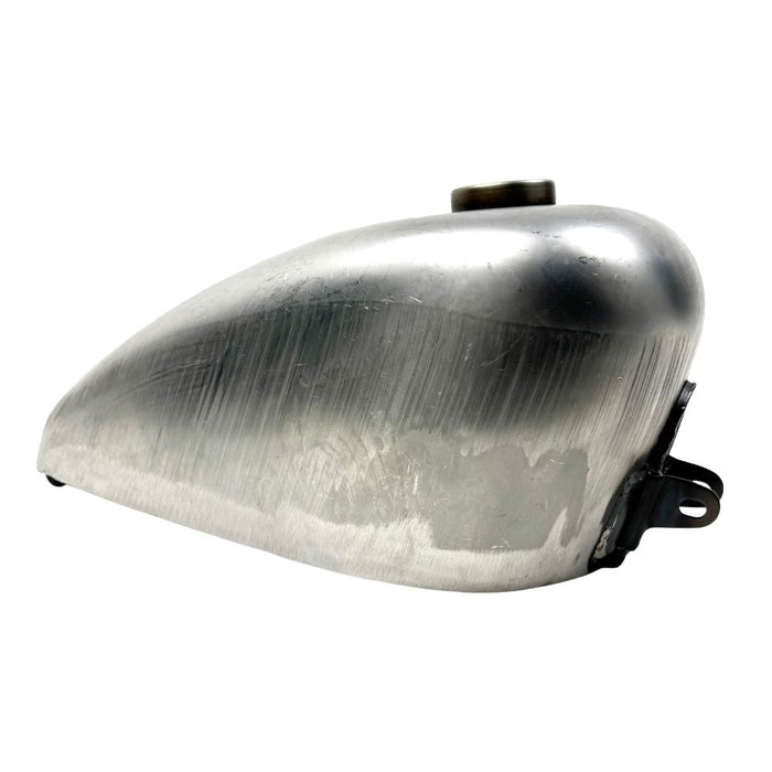 The Wyatt Gatling 2 Gallon Gas Tank features unpainted metal with visible weld marks and a top-mounted fuel cap, designed for 1958-1978 Harley-Davidson Sportster models.