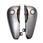 Two metal Drag Specialties Fat Bob-Style Gas Tank halves, each with visible welds and fuel caps, are positioned upright side by side on a white background. These classic 3.5-gallon tanks are ideal for customizing your motorcycle and fit perfectly on various Softail models.