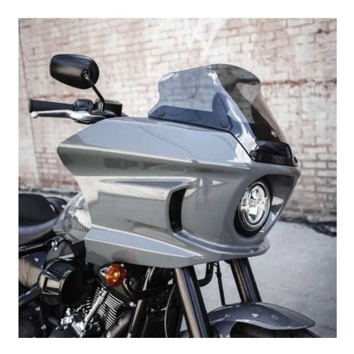 Gray Klockwerks Flare windshield - 6" - Dark Smoke - For 2022-2024 Softail Low Rider ST FXLRST with a logo in the center.