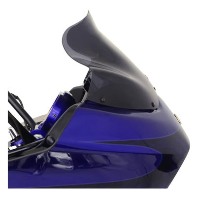 Close-up of the rear side and tailpiece of a blue sport motorcycle with a Klockwerks Flare Windshield - 12" - Dark Smoke - For 1998-2013 FLTR isolated on a white background.