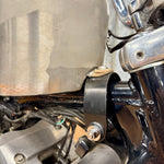 The TC Bros. Frisco Gas Tank Adapter Brackets set for 1982-2003 Harley-Davidson Sportster includes black metal brackets, bolts, washers, nuts, and rubber grommets—perfect for tongue-mount fuel tank installations.