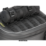 The Nelson-Rigg Trails End Bottle Holder is a black roll-top utility pouch with multiple straps and buckles, designed for secure fuel bottle storage and attachment on your motorcycle rides.
