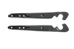 A pair of Wyatt Gatling gloss black elongated metal fender strut covers with curved top cutouts and three bolt holes each, designed for 2004-2022 Harley-Davidson Sportster models, shown side by side on a white background.