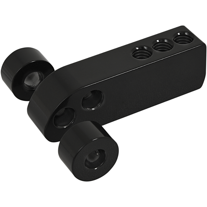 Memphis Shades Headlight Extension Block MEB9885—black metal bracket with three cylindrical rollers and four threaded holes, used as a headlamp mount or fairing assembly component, shown isolated on white.