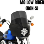 Front view of a blue 2018-2020 Harley-Davidson Low Rider equipped with a Memphis Shades Road Warrior Fairing for improved wind protection and showcasing a distinctive round headlight.