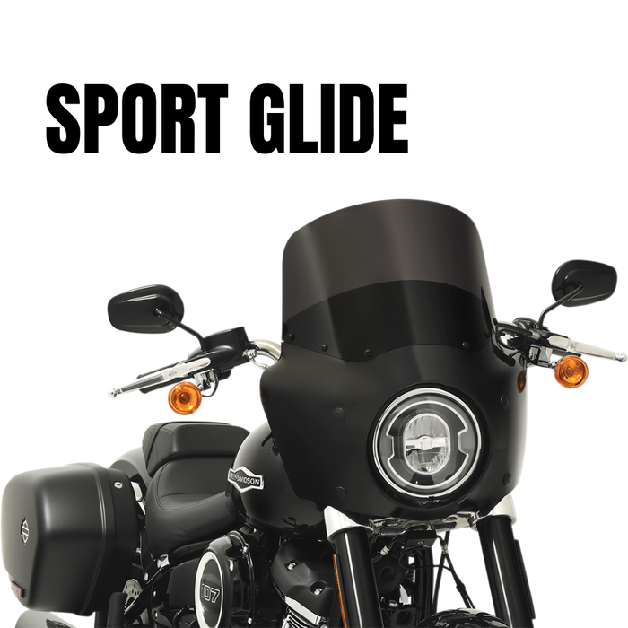 Front view of a black Harley-Davidson Sport Glide (2018-2024) with saddlebags, headlight, and Memphis Shades Road Warrior Fairing for enhanced wind protection, set against a white background with "SPORT GLIDE" text above.