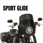 Front view of a black Harley-Davidson Sport Glide (2018-2024) with saddlebags, headlight, and Memphis Shades Road Warrior Fairing for enhanced wind protection, set against a white background with "SPORT GLIDE" text above.