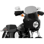 Two motorcycles display black front fairings, including a Road Warrior Fairing equipped with the Memphis Shades Windshield. Below them are three separate black Memphis Shades pieces, made from Lucite in different shapes and with various cutouts.