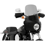 Two motorcycles display black front fairings, including a Road Warrior Fairing equipped with the Memphis Shades Windshield. Below them are three separate black Memphis Shades pieces, made from Lucite in different shapes and with various cutouts.