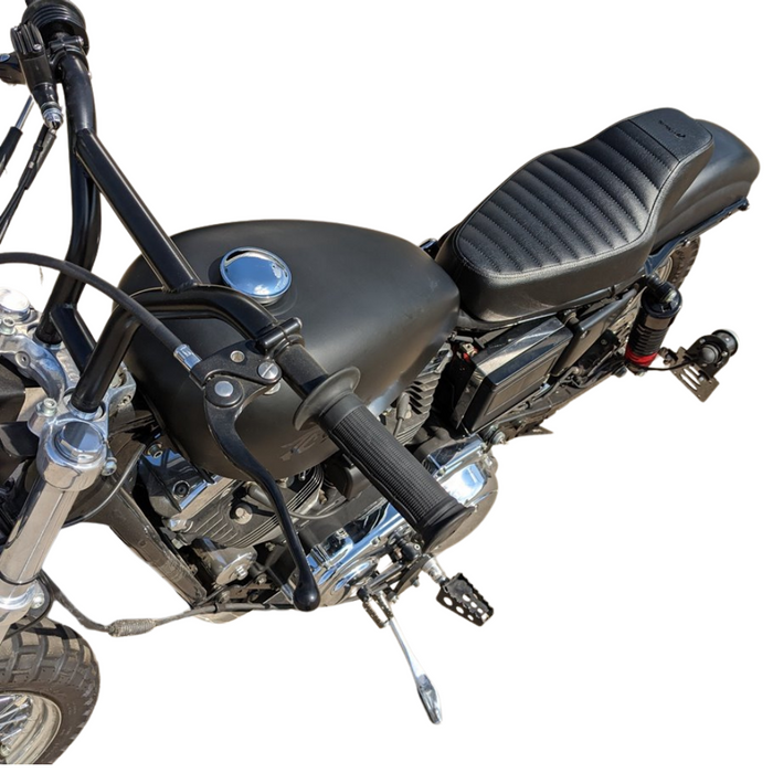 The TC Bros. Tracker Seat for Harley-Davidson Sportster 1986-2003 by TC Bros. is shown above a partially visible Sportster motorcycle.