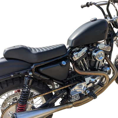 The TC Bros. Tracker Seat for Harley-Davidson Sportster 1986-2003 by TC Bros. is shown above a partially visible Sportster motorcycle.