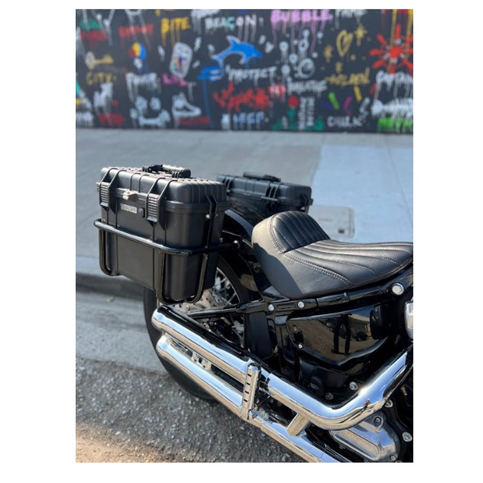 Two black, waterproof Speedwell Vigilante Saddlebags - Harley M8 Softail (with tail light/turn signal kit) with handles, one open and one closed, displayed against a white background.