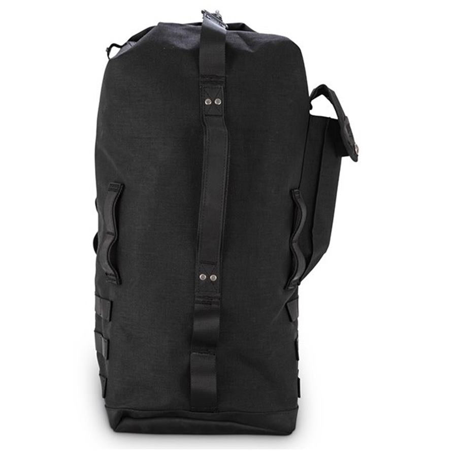 The Burly Voyager Motorcycle Sissy Bar Backpack by Burly is available in black and crafted from durable Black Cordura. It features multiple compartments, a buckled front pocket, and additional side handles. The backpack is also equipped with a MOLLE system for versatile attachment options.