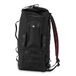 The Burly Voyager Motorcycle Sissy Bar Backpack by Burly is available in black and crafted from durable Black Cordura. It features multiple compartments, a buckled front pocket, and additional side handles. The backpack is also equipped with a MOLLE system for versatile attachment options.