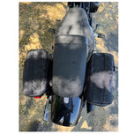 Introducing the Speedwell Cutaway Saddlebags for Harley Sportsters, M8 Softail, and Dyna—an elegant black saddlebag featuring dual compartments with stitched detailing and handles on each side. Expertly designed to straddle over the back of a motorcycle seat, it&