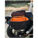 Introducing the Speedwell Cutaway Saddlebags for Harley Sportsters, M8 Softail, and Dyna—an elegant black saddlebag featuring dual compartments with stitched detailing and handles on each side. Expertly designed to straddle over the back of a motorcycle seat, it&