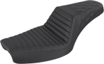 The Saddlemen Step-Up Seat for 1996-2003 Harley-Davidson Dyna is shown with other Saddlemen seats in black and brown, highlighting diverse designs and textures against a white background.