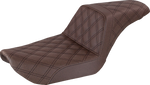 The Saddlemen Step-Up Seat for 1996-2003 Harley-Davidson Dyna is shown with other Saddlemen seats in black and brown, highlighting diverse designs and textures against a white background.