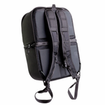 A man stands by his bike with the Throttle Twist Hybrid Saddlebag/Backpack—versatile motorcycle luggage that easily converts into a backpack. Text: "Convertible Saddlebags/Backpack." Brand: Throttle Twist.