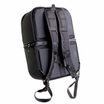 A man stands by his bike with the Throttle Twist Hybrid Saddlebag/Backpack—versatile motorcycle luggage that easily converts into a backpack. Text: "Convertible Saddlebags/Backpack." Brand: Throttle Twist.