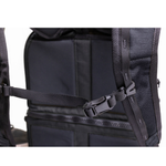 A man stands by his bike with the Throttle Twist Hybrid Saddlebag/Backpack—versatile motorcycle luggage that easily converts into a backpack. Text: "Convertible Saddlebags/Backpack." Brand: Throttle Twist.